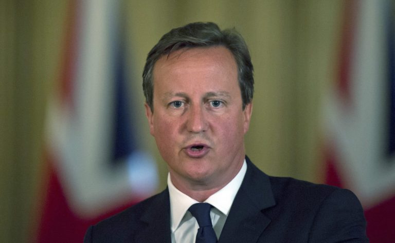 British Prime Minister David Cameron delivers a report to the media in Downing Street, London, Friday Aug. 29, 2014.  Britain's Home Secretary Theresa May has announced that UK's terror threat level is being raised from 