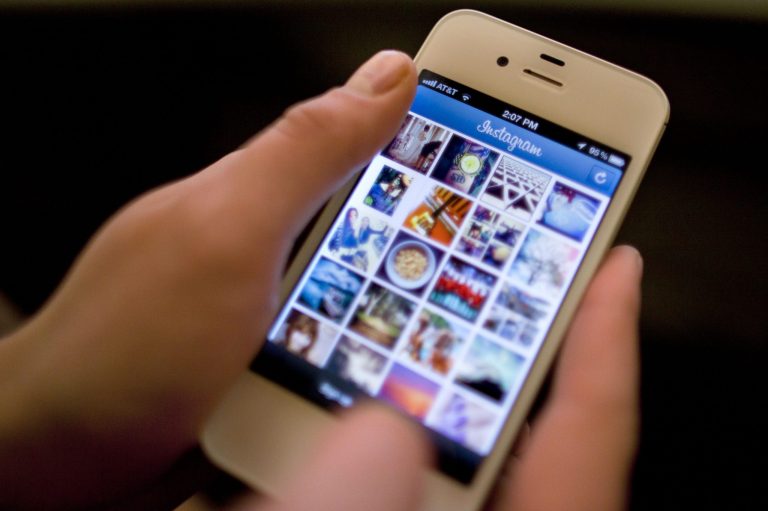   FILE - In this Monday, April 9, 2012, file photo, Instagram is demonstrated on an iPhone, in New York. Instagram, the popular photo-sharing service that Facebook bought this year, is the target of a storm of outrage on Twitter and other sites after the company announced Monday, Dec. 17, 2012 a change in its user agreement that hinted that it might use shared photos in ads. (AP Photo/Karly Domb Sadof, File)  