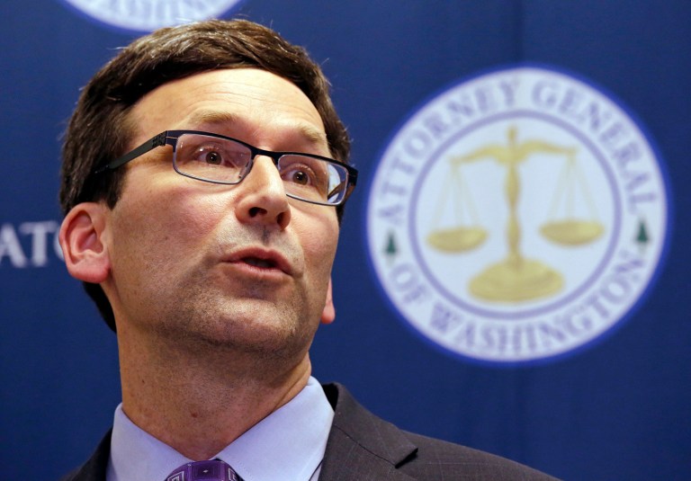 Washington Attorney General Bob Ferguson speaks at a news conference about a federal appeals court's refusal to reinstate President Donald Trump's travel ban. (AP Photo/Elaine Thompson)