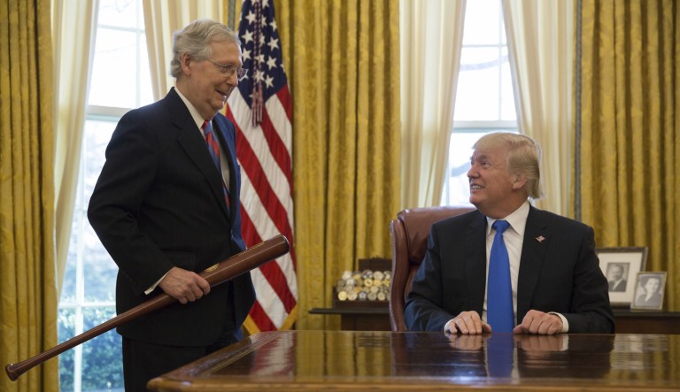 Senate Majority Leader Mitch McConnell, R-Ky., presented President Trump with a baseball bat Wednesday, celebrating a 