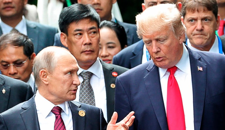 President Trump, right, and Russia's President Vladimir Putin talk during the family photo session at the APEC Summit in Da Nang, Vietnam, Saturday, Nov. 11, 2017. (Mikhail Klimentyev, Sputnik, Kremlin Pool Photo via AP)