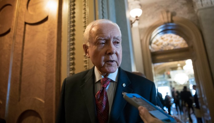 "Every good fighter knows when to hang up the gloves," Sen. Orrin Hatch said in a video, referring to his boxing days. "For me, that is soon approaching." (AP Photo/J. Scott Applewhite)
