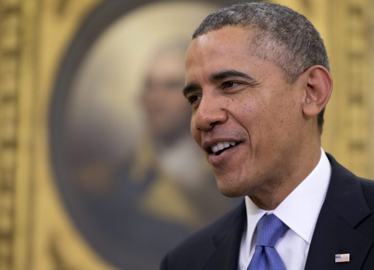 President Obama smiles as he stands with Tunisian Prime Minister Mehdi Jomaa after speaking to the media on Friday in the Oval Office of the White House in Washington. (AP Photo/Carolyn Kaster)