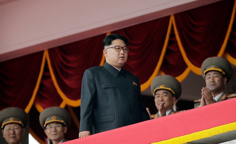 North Korean leader Kim Jong Un celebrated a military submarine's launching of a ballistic missile, calling the test fire 