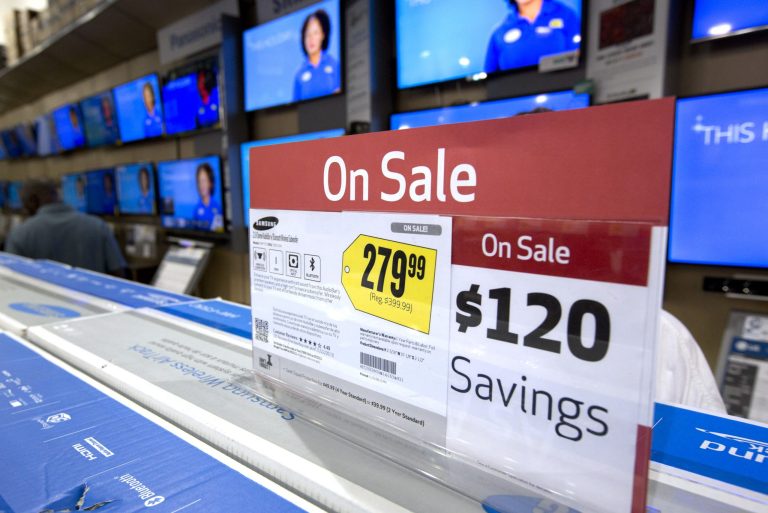 FILE - In this Friday, Nov. 29, 2013, file photo TV sets, are on sale in the Pembroke Pines, Fla. Best Buy store. As stores clear out older merchandise and new models get introduced, good deals abound if you want a big new TV for the Super Bowl or video games. (AP Photo/J Pat Carter, File)