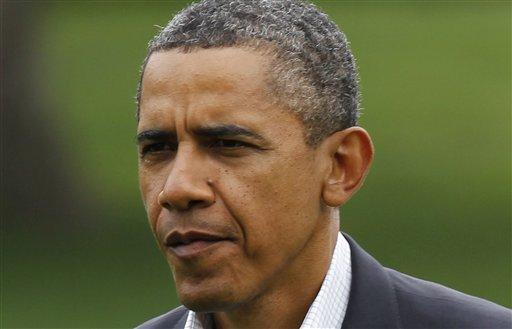 President Barack Obama walks on the South Lawn of the White House in Washington as he returns from a trip to Detroit where he addressed a Labor Day rally, Monday, Sept. 5, 2011.