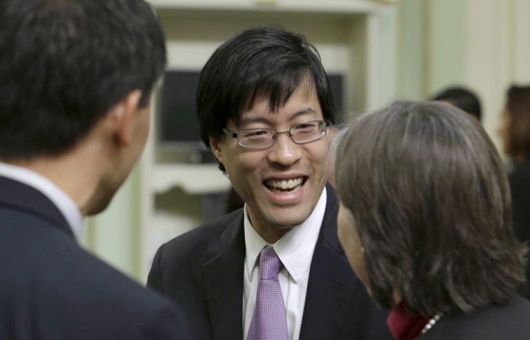 California State Assemblyman Richard Pan, D-Sacramento, center, at the Capitol in Sacramento, Calif. From California to Rhode Island, many states are finding that their health care costs for low-income residents will rise as an unintended consequence of the new federal health care law. (AP Photo/Rich Pedroncelli)