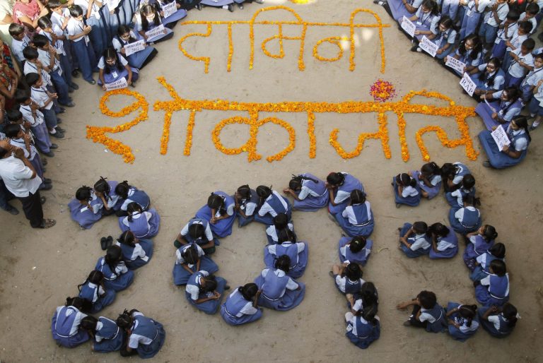   Indian schoolgirls form numbers representing the year 2013 during a prayer ceremony in Ahmadabad, India, Monday, Dec. 31, 2012. The gang-rape and killing of a New Delhi student has set off an impassioned debate about what India needs to do to prevent such a tragedy from happening again. The country remained in mourning Monday, two days after the 23-year-old physiotherapy student died from her internal wounds in a Singapore hospital. Floral writing at the center reads 