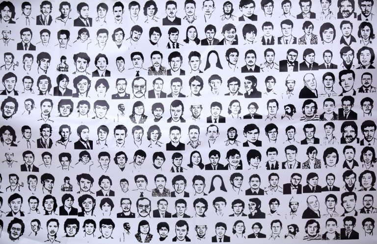   FILE - In this May 10, 2012, file photo, a banner shows ink drawings of missing people at the National March for Dignity on the day Mexicans celebrate el Dia de La Madre, or Mother's Day, in Mexico City. Propuesta Civica, or Civic Proposal, a civic organization released on its website on Thursday, Dec. 20, 2012, a database, allegedly collected by the federal Attorney General's Office, it says contains official information on more than 20,000 people who have disappeared in Mexico over the past six years. (AP Photo/Alexandre Meneghini, file)  