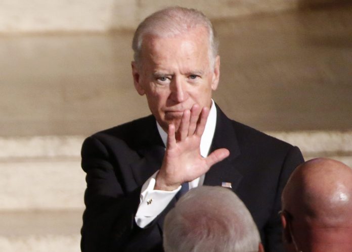 Vice President Joe Biden waves during funeral services for his son, Beau Biden, Saturday, June 6, 2015, at St. Anthony of Padua Church in Wilmington, Del. (Yuri Gripas/Pool Photo via AP)