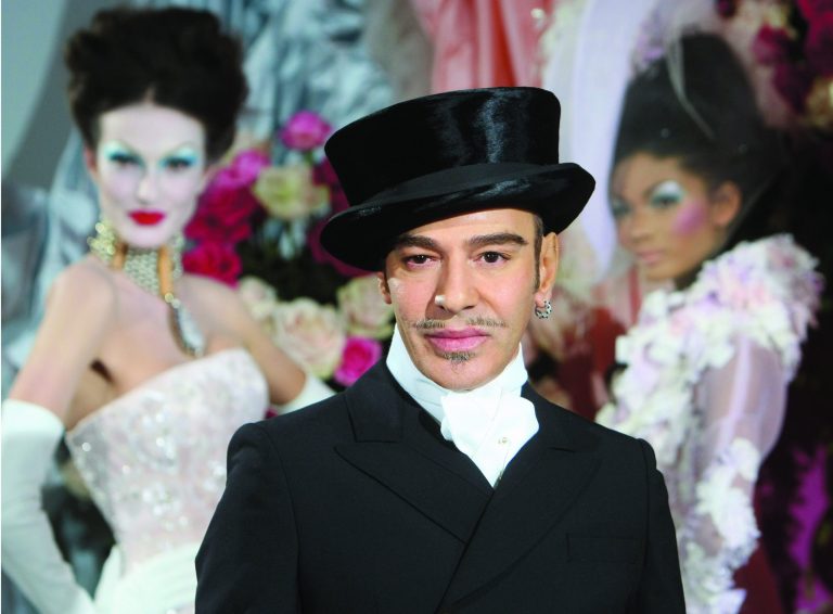 FILE - In this Jan. 25, 2010 file photo, fashion designer John Galliano poses at the end of the presentation of the Dior Haute Couture spring/summer 2010 fashion collection in Paris. Galliano landed on the front of the New York Post on Wednesday, Feb. 13, 2013, with a photo of the designer wearing a hat and ringlets described as resembling those of a Hasidic Jew. Galliano was fired from Christian Dior two years ago after his anti-Semitic rant was caught on video, and the tabloid said the outfit 