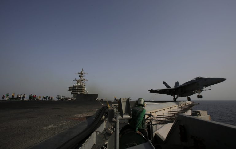 An F/A-18C Hornet takes off for Iraq from the flight deck of the U.S. Navy aircraft carrier USS George H.W. Bush on Sunday, Aug. 10, 2014 in the Persian Gulf. (AP Photo/Hasan Jamali)