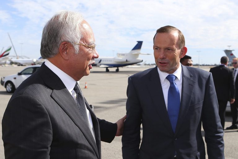 Australian Prime Minister Tony Abbott, chats with Malaysian Prime Minister Najib Razak, left, at Perth International airport on April 3, 2014 in Perth, Australia as Razak prepares to depart Australia after his visit during the search of missing Malaysia Airlines flight MH370. The search continues off the Western Australian coast for Malaysia Airlines flight MH370 that vanished on March 8 with 239 passengers and crew on board. (AP Photo/Paul Kane, Pool)