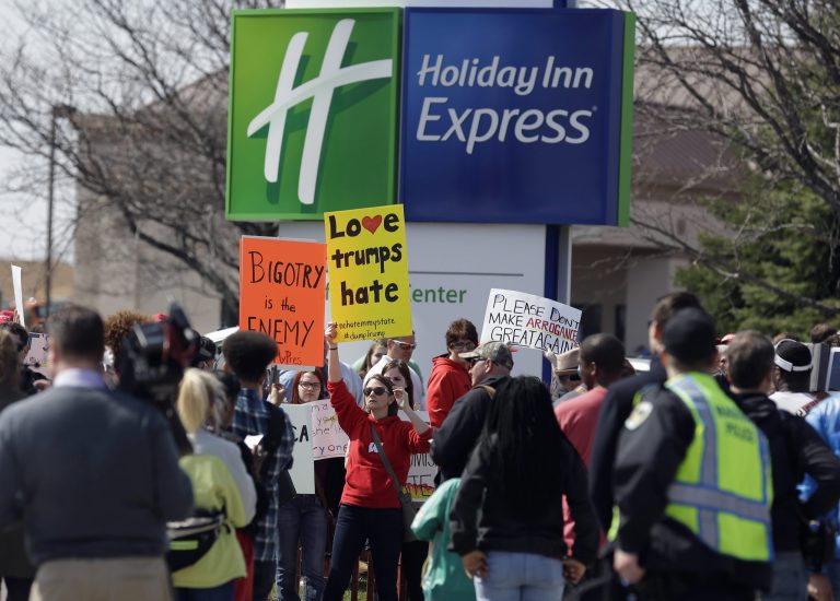 Pictures and video footage posted to social media show the young girl surrounded by protesters and rally attendees at a Holiday Inn Express in Janesville, Wis. (AP Photo/Nam Y. Huh)