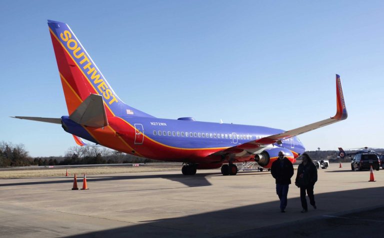 FILE - In this Jan. 13, 2014 file photo, Southwest Airlines Flight 4013 sits at the M. Graham Clark Downtown Airport in Hollister, Mo. The plane was supposed to land at the nearby Branson Airport on Sunday evening, but instead landed at Clark Airport, also known as Taney County Airport, which has a much shorter runway than at Branson, about 7 miles away. The plane's pilots have told investigators they were confused by the small airport's runway lights, believing it to be a larger airport in nearby Branson, the National Transportation Safety Board said Friday, Jan. 17, 2014. (AP Photo/Springfield News-Leader, Valerie Mosley, File)
