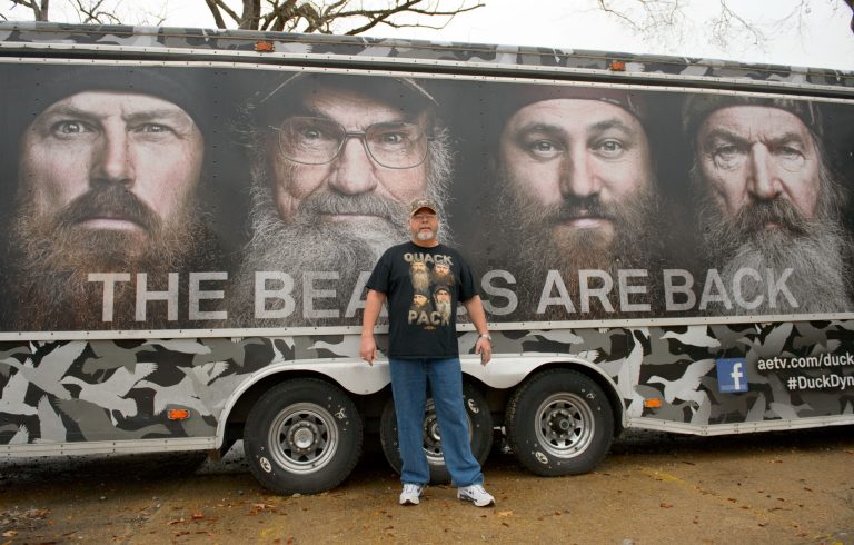 Howell Henderson of Joplin, Mo., poses for a picture outside the Duck Commander store in West Monroe, La. Saturday, Dec. 21, 2013. The town is the setting for the popular 