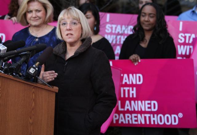 U.S. Sen. Patty Murray, center, speaks at the Seattle Planned Parenthood branch on Friday, Feb. 3, 2012, in Seattle, Wash. Murray had planned to discuss Susan G. Komen Foundation's recent decision to rescind their funding to Planned Parenthood's breast exam services, but Komen announced a reversal of their decision early Friday morning. (AP Photo/TheSeattle Times, John Lok)