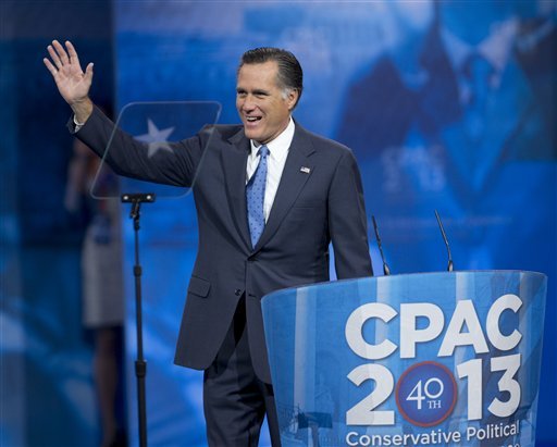 Former Massachusetts Gov. Mitt Romney, waves as he arrives to speak at the 40th annual Conservative Political Action Conference in National Harbor.  (AP Photo/Manuel Balce Ceneta)