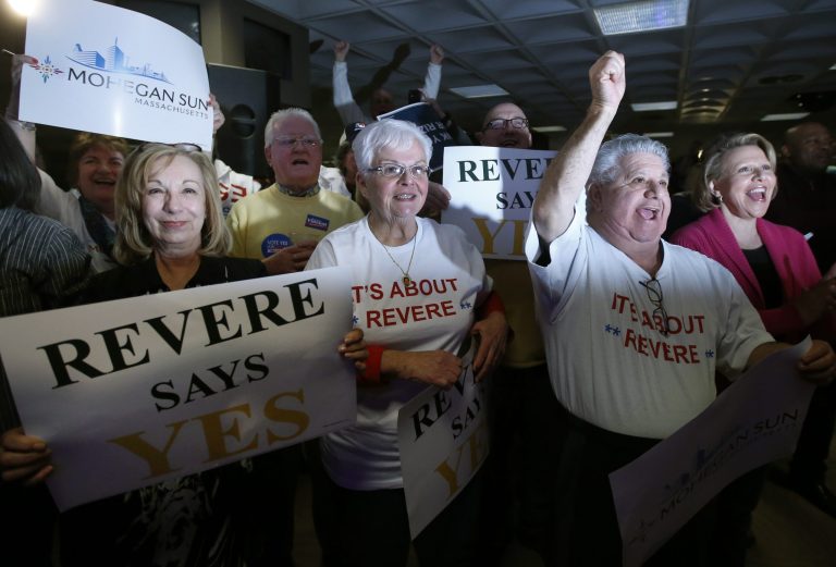 Supporters cheer at Suffolk Downs as they celebrate the passage of a referendum allowing the Mohegan Sun to move forward with its $1.3 billion proposal in Revere and compete with Wynn Resorts for the sole eastern Massachusetts resort casino, in Revere, Mass., Tuesday, Feb. 25, 2014. (AP Photo/Elise Amendola)