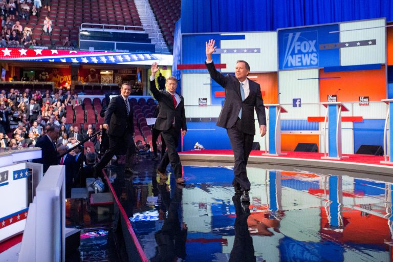 Republican presidential candidates from left, Sen. Ted Cruz, R-Texas, Sen. Rand Paul, R-Ky., and Ohio Gov. John Kasich take the stage for the first Republican presidential debate at the Quicken Loans Arena, Thursday, Aug. 6, 2015, in Cleveland. (AP Photo/Andrew Harnik)