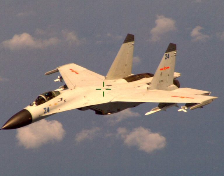 This handout photo provided by the Office of the Defense Secretary (OSD), taken Aug. 19, 2014,  shows a Chinese fighter jet that the Obama administration said Friday conducted a 