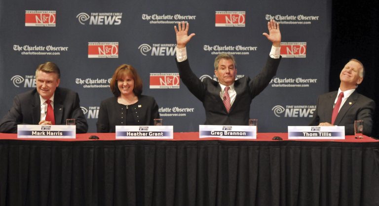 Republican senatorial candidate Greg Brannon, second from left, reacts to a question as Thom Tillis, right, Mark Harris, left, and Heather Grant, second from left, laugh during a debate at Davidson College in Davidson, N.C., Tuesday. (AP Photo/Charlotte Observer, Todd Sumlin, Pool)