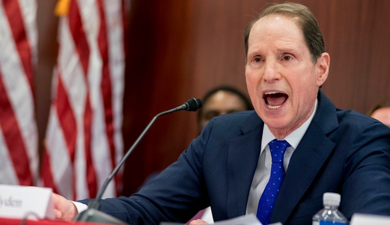 Sen. Ron Wyden of Oregon, the ranking Democrat on the Finance Committee, said Wednesday's report is the first in a series planned on how the law will affect companies and workers. (AP Photo/Andrew Harnik)