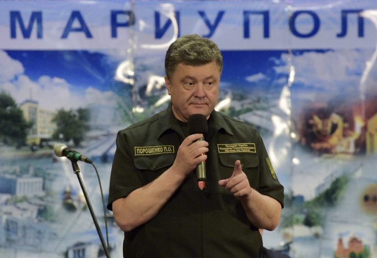 Ukrainian President Petro Poroshenko speaks to workers during his visit to the Ilich Iron and Steel Works in the southern coastal town of Mariupol, Ukraine, Monday, Sept. 8, 2014. Members of Congress are requesting the opportunity to hear from Poroshenko in a joint session. (AP Photo/Mykola Lazarenko, Pool)