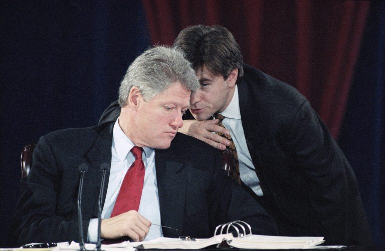 Director of Communications for the transition, George Stephanopoulos, right, speaks to President-elect Bill Clinton during session of the Economic Conference in Little Rock, Arkansas, Dec. 15, 1992. (AP Photo/Greg Gibson)