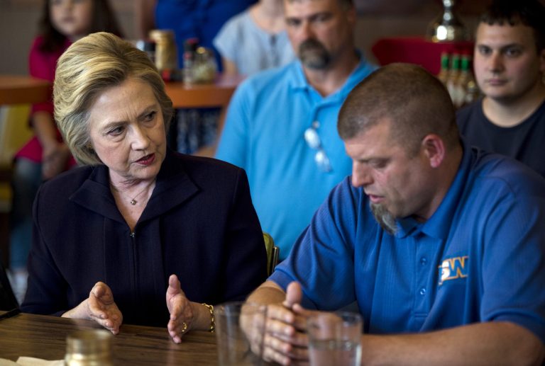 Hillary Clinton speaks with local steel workers and civic leaders during a campaign stop at Alma's Italian Cafe in Ashland, Ky., on May 2. (Bill Clark/CQ Roll Call via AP)