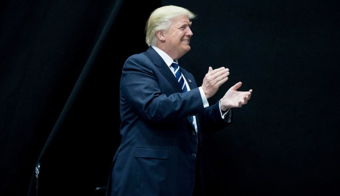 "Things are going really well for our economy, a subject the Fake News spends as little time as possible discussing! Stock Market hit another RECORD HIGH, unemployment is now at a 17 year low and companies are coming back into the USA. Really good news, and much more to come!" Trump tweeted. (AP Photo/Andrew Harnik)