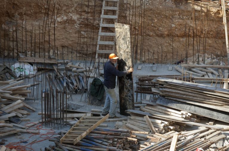   A Palestinian worker is seen on a construction site in the east Jerusalem neighborhood of Ramat Sholmo, Tuesday, Dec. 18, 2012. A European diplomat says Germany and three other European members of the U.N. Security Council are preparing a statement condemning Israel's latest settlement plans in the West Bank.(AP Photo/Dan Balilty)  