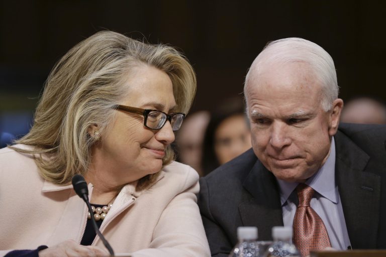 FILE - In this Jan. 24, 2013, file photo, then-Secretary of State Hillary Rodham Clinton huddles with Sen. John McCain, R-Ariz., on Capitol Hill in Washington. McCain and Clinton share a friendship forged in the Senate, on fact-finding trips around the globe and over vodka shots in Estonia. He's a former Republican presidential nominee. She could be the next Democratic presidential nominee. And lately, the Clintons and McCains seem to have embraced each other, offering up their families' working relationship as an example of wlkays political leaders can overcome the partisan divide. (AP Photo/J. Scott Applewhite, File)