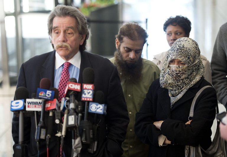 Zarine Kahn (R) and Shafi Ullah Khan (C), the parents of Mohammed Hamzah Khan, 19, listen as their son's attorney Thomas Anthony Durkin speaks to reporters after a bond hearing for their son on October 9, 2014 in Chicago, Illinois. Mohammed Kahn was arrested on Oct. 4 while attempting to board a flight at O'Hare International Airport to Vienna, where he allegedly planned to travel on to Istanbul and eventually to Islamic State locations in Iraq or Syria according to the criminal complaint filed against him. (Photo by Brian Kersey/Getty images)