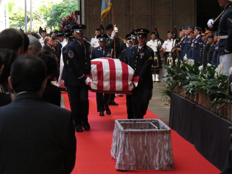   Pallbearers carry the casket of U.S. Sen. Daniel Inouye into the courtyard of the Hawaii state Capitol during a visitation ceremony in Honolulu on, Saturday Dec. 22, 2012. (AP Photo/Oskar Garcia)  
