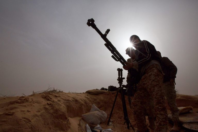 In this Saturday, Feb. 21, 2015 photo, Libyan soldiers try to fix a weapon that jammed during clashes with militants on the frontline in Al Ajaylat, 120 kilometers (75 miles) west of Tripoli, Libya. (AP Photo)