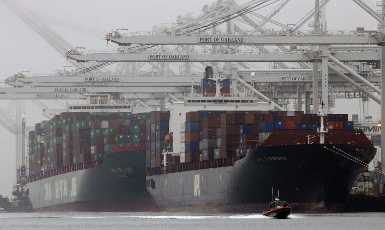FILE - In this Wednesday, Oct. 23, 2013, file photo, container ships wait to be off-loaded in a thick fog at the Port of Oakland in Oakland, Calif. The Commerce Department releases fourth-quarter gross domestic product on Friday, Feb. 28, 2014. (AP Photo/Ben Margot, File)