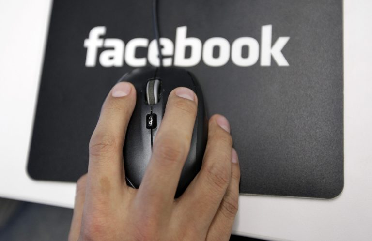   FILE - In this Tuesday, Dec. 13, 2011, file photo, a Facebook User Operations Safety Team worker looks at reviews at Facebook headquarters in Menlo Park, Calif. Curating your facebook news feed, and other practices that can help personalize a user's facebook activity can be burdensome process, but the result: Less tabloid magazine, more personal messages and cute pictures from people who are actually your friends. (AP Photo/Paul Sakuma, File)  