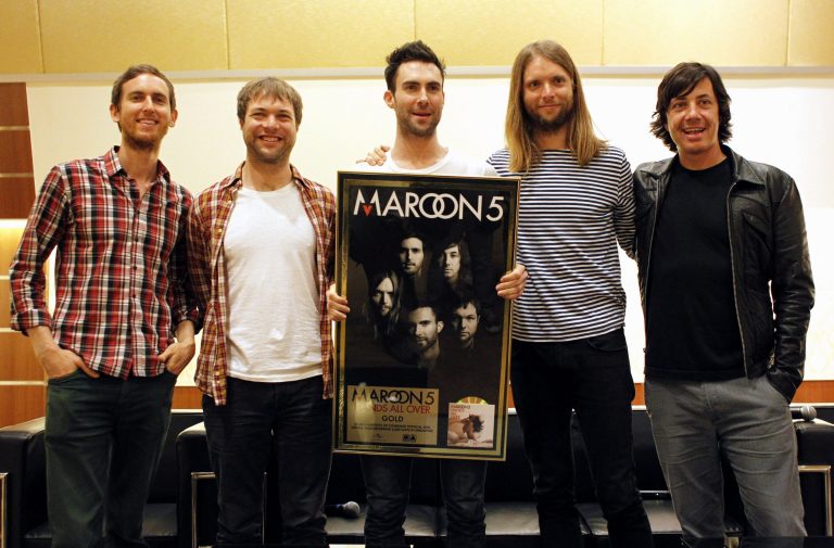 FILE - Members of American rock band Maroon 5, from left, Jesse Carmichael, Mickey Madden, Adam Levine, James Valentine and Matt Flynn, pose during a press conference at the Singapore Indoor Stadium in this April 25, 2011 file photo taken in Singapore. The Grammy-winning band announced Monday April 1, 2013 that they will headline the 2013 Honda Civic Tour, which kicks off Aug. 1 in St. Louis and will feature Kelly Clarkson. (AP Photo/Wong Maye-E, File)