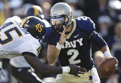 Patrick Semansky/AP
Navy quarterback Kriss Proctor is expected to miss Saturday's game at Notre Dame.