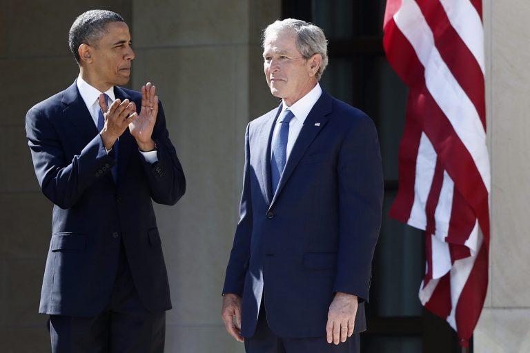 In this April 25, 2013 file photo, President Barack Obama stands with former president George W. Bush at the dedication of the George W. Bush presidential library on the campus of Southern Methodist University in Dallas. (AP Photo/Charles Dharapak, File)