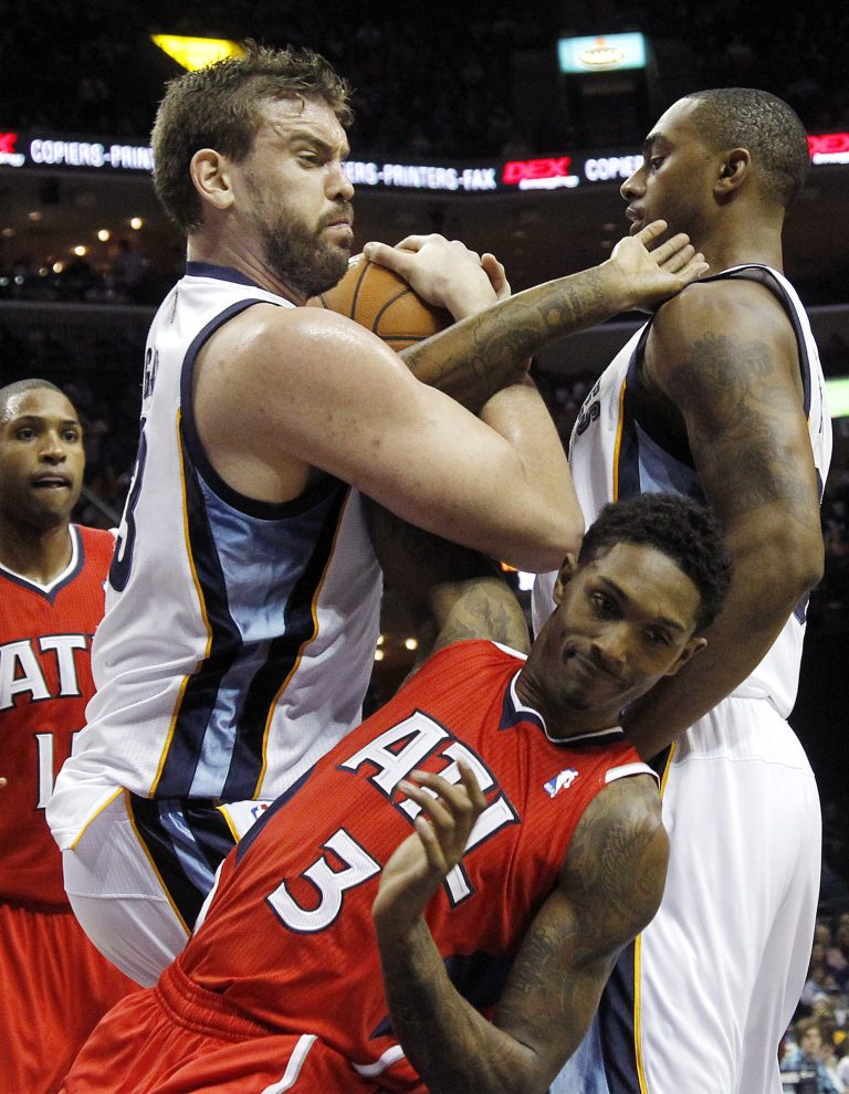   Memphis Grizzlies forward Rudy Gay (22) fights for a loose ball with Atlanta Hawks guard Louis Williams (3) in the first half of an NBA basketball game on Saturday, Dec. 8, 2012, in Memphis, Tenn. (AP Photo/Lance Murphey)  