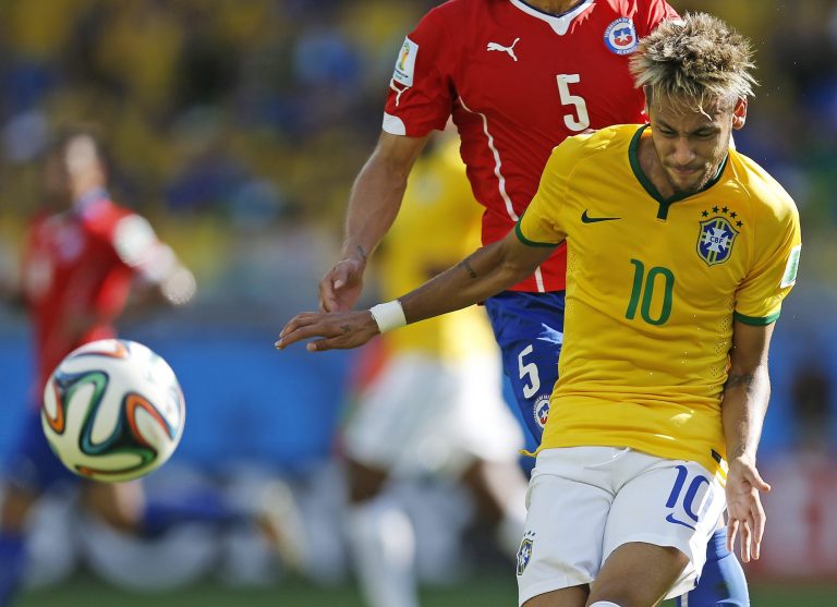 Brazil's Neymar fights for the ball with Chile's Francisco Silva during the World Cup round of 16 soccer match between Brazil and Chile at the Mineirao Stadium in Belo Horizonte, Brazil, Saturday, June 28, 2014. (AP Photo/Frank Augstein)