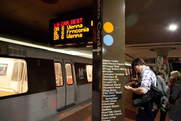 Passengers wait for trains at Metro Center in this December 2011 file photo. 