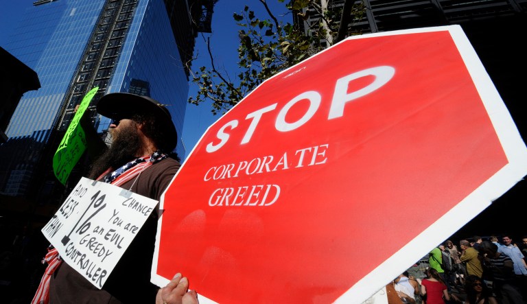 Not everyone agrees that capitalism and democracy are good. As seen in an opinion piece in Splinter, some argue that there is a moral foundation for thievery — particularly against the rich. (AP Photo/Henny Ray Abrams)