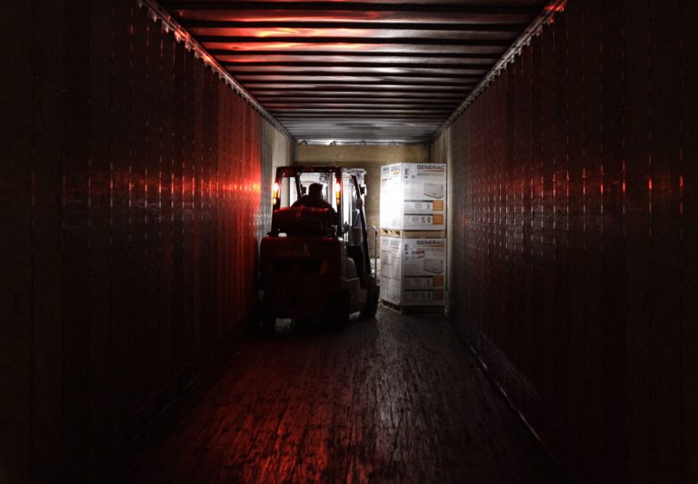   In this Friday, Nov. 16, 2012, photo, an employee works at a shipping area of Generac Power Systems, Inc., one of the largest makers of residential generators in the U.S., in Whitewater, Wis. A survey shows U.S. manufacturing shrank in November to its weakest level since July 2009, the first month after the Great Recession ended. Worries about automatic tax increases in the New Year cut demand for factory orders and manufacturing jobs. (AP Photo/Nam Y. Huh)  