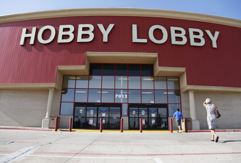 Customers walk to a Hobby Lobby store in Oklahoma City, Monday, June 30, 2014. (AP Photo/Sue Ogrocki)