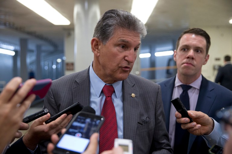 FILE- In this June 20, 2016, file photo, Sen. Joe Manchin, D-W.Va., talks with reporters on Capitol Hill in Washington. Manchin remained mum Wednesday as a pharmaceutical company run by his daughter faced mounting criticism for hiking prices on life-saving allergy injection pens. (AP Photo/Alex Brandon, File)