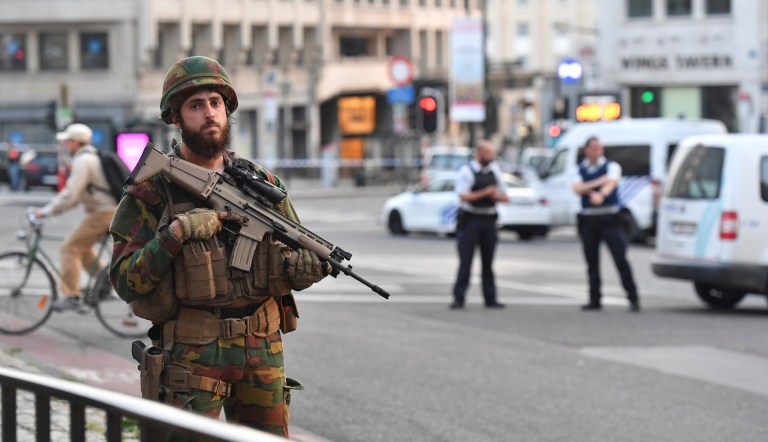 The man appeared to be shot by police. (AP Photo/Geert Vanden Wijngaert)