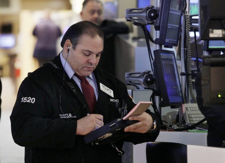   FILE - In this Tuesday, Dec. 11, 2012, file photo, trader Anthony Riccio works on the floor of the New York Stock Exchange. Expectations that the Federal Reserve will announce a new stimulus plan to help bring life to a lethargic U.S. economy boosted stock markets in Asia, where investors brushed off North Korea's latest test launch of a long-range rocket. (AP Photo/Richard Drew, File)  